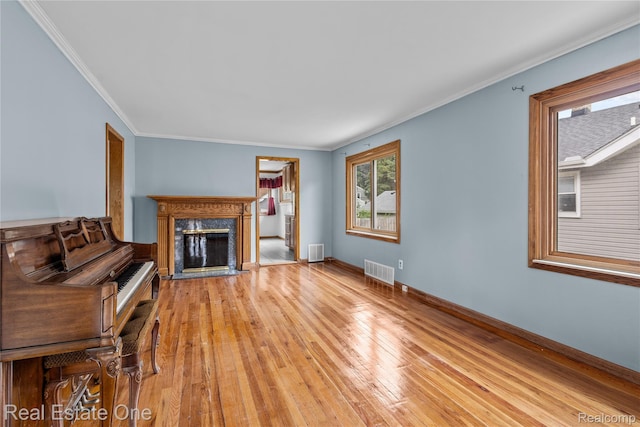 212 La Plaza Ct, Royal Oak, MI 48073 - unfurnished living room featuring light wood finished floors, a fireplace, and ornamental molding