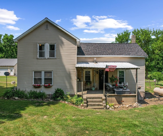 278 E Southern Rd, Coldwater, MI 49036 - view of front of house featuring a front lawn, roof with shingles, a chimney, and an outdoor living space