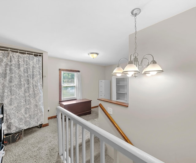 278 E Southern Rd, Coldwater, MI 49036 - hallway featuring carpet flooring and a chandelier