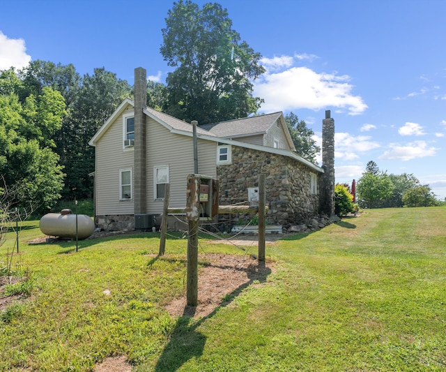 278 E Southern Rd, Coldwater, MI 49036 - back of property featuring a chimney, a yard, and stone siding