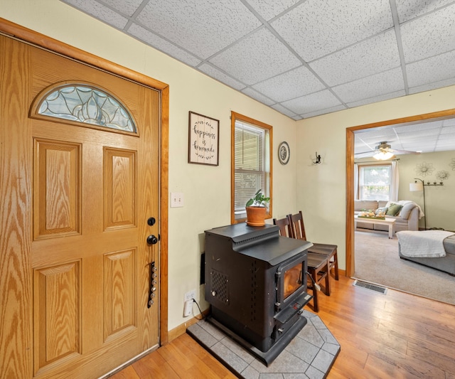 278 E Southern Rd, Coldwater, MI 49036 - foyer with a paneled ceiling, a wood stove, and light wood finished floors