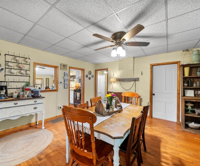 278 E Southern Rd, Coldwater, MI 49036 - dining space with a drop ceiling, light wood-style flooring, and ceiling fan