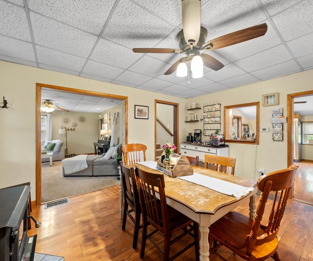 278 E Southern Rd, Coldwater, MI 49036 - dining space with a paneled ceiling, a ceiling fan, and light wood-style floors