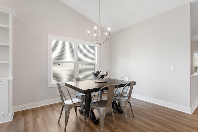 1519 Eagle Shore Ct, Hudsonville, MI 49426 - dining space featuring light wood-style flooring, a chandelier, and lofted ceiling