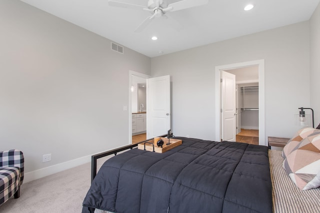 1519 Eagle Shore Ct, Hudsonville, MI 49426 - bedroom featuring recessed lighting, a spacious closet, light colored carpet, and a ceiling fan