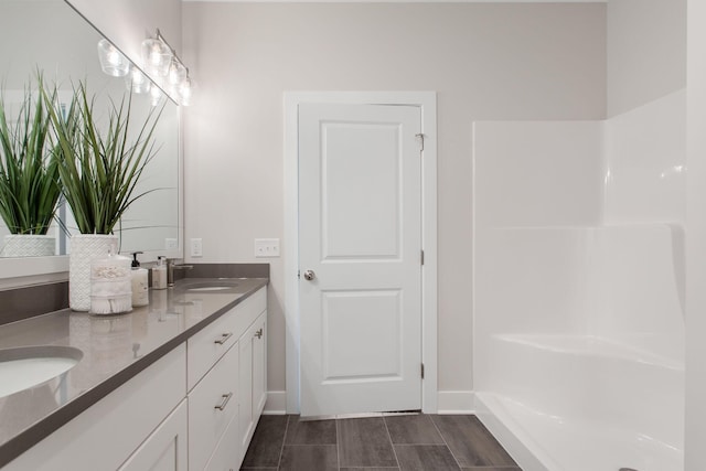 1519 Eagle Shore Ct, Hudsonville, MI 49426 - bathroom featuring double vanity and baseboards