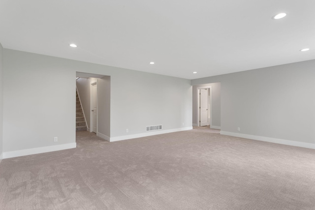 1519 Eagle Shore Ct, Hudsonville, MI 49426 - empty room with light carpet, recessed lighting, and stairs
