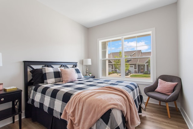 1519 Eagle Shore Ct, Hudsonville, MI 49426 - bedroom featuring wood finished floors and baseboards