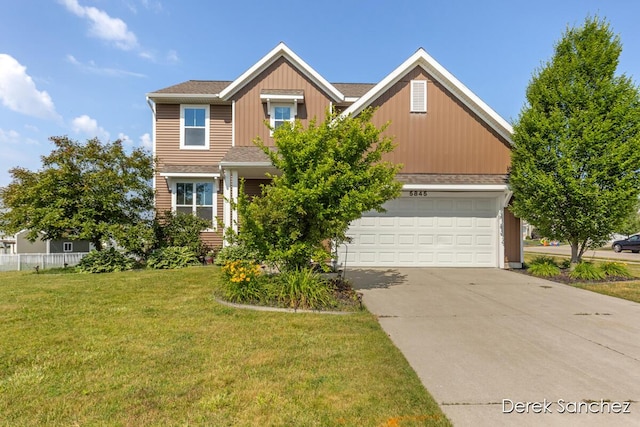 5845 Nile Dr SW, Wyoming, MI 49418 - view of front of property featuring a front yard, a garage, and driveway