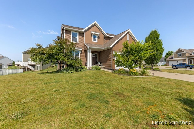 5845 Nile Dr SW, Wyoming, MI 49418 - view of front facade featuring a front yard and driveway