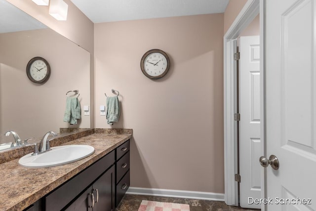 5845 Nile Dr SW, Wyoming, MI 49418 - bathroom with baseboards and vanity