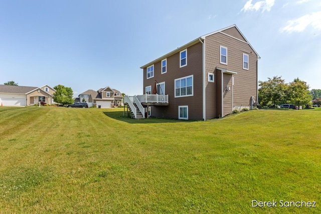 5845 Nile Dr SW, Wyoming, MI 49418 - rear view of property with a lawn, a deck, and stairs