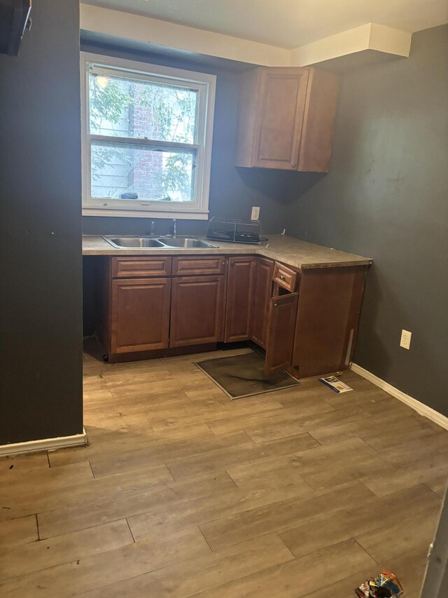 20026 Avon Ave, Detroit, MI 48219 - kitchen featuring light wood-type flooring and light countertops