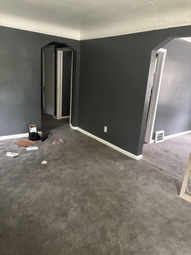 20026 Avon Ave, Detroit, MI 48219 - unfurnished room with arched walkways and carpet flooring