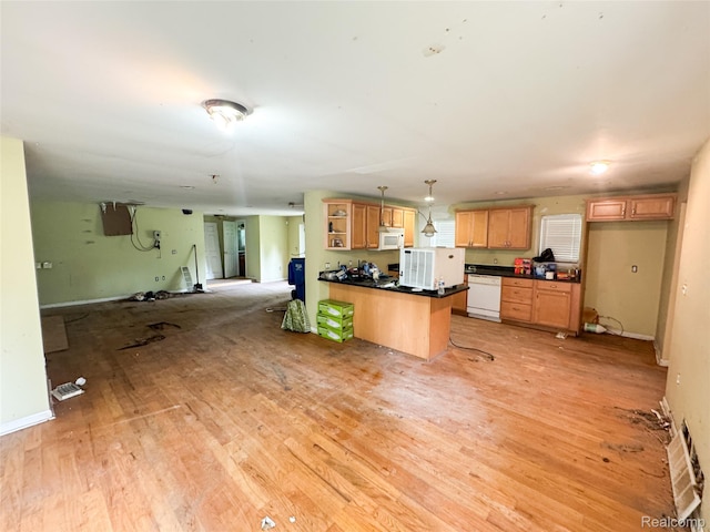 7889 Chilson Rd, Hamburg, MI 48169 - kitchen featuring open shelves, a peninsula, dark countertops, white appliances, and light wood-style flooring