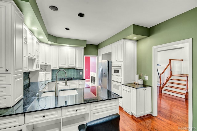 584 Cambridge Way, Bloomfield Hills, MI 48304 - kitchen with white cabinetry, decorative backsplash, recessed lighting, and a peninsula