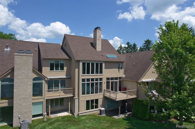 584 Cambridge Way, Bloomfield Hills, MI 48304 - back of house with a chimney, a shingled roof, and a yard