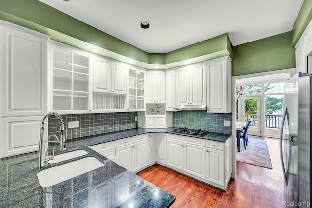 584 Cambridge Way, Bloomfield Hills, MI 48304 - kitchen with freestanding refrigerator, white cabinets, wood finished floors, and tasteful backsplash