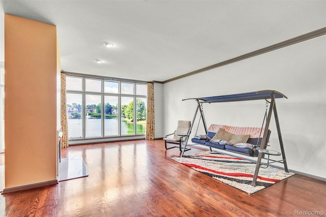 584 Cambridge Way, Bloomfield Hills, MI 48304 - living area with crown molding, wood finished floors, and a water view