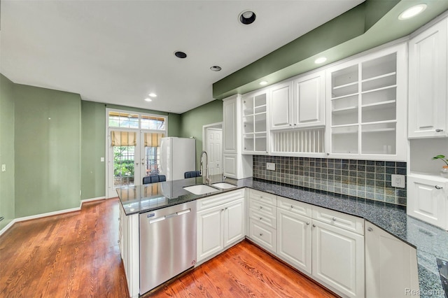 584 Cambridge Way, Bloomfield Hills, MI 48304 - kitchen featuring stainless steel dishwasher, light wood finished floors, a peninsula, white cabinetry, and glass insert cabinets