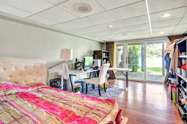 584 Cambridge Way, Bloomfield Hills, MI 48304 - bedroom with access to exterior, a drop ceiling, wood finished floors, an office area, and recessed lighting