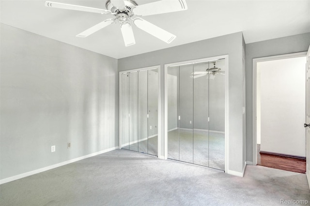 584 Cambridge Way, Bloomfield Hills, MI 48304 - unfurnished bedroom featuring multiple closets, carpet flooring, and ceiling fan