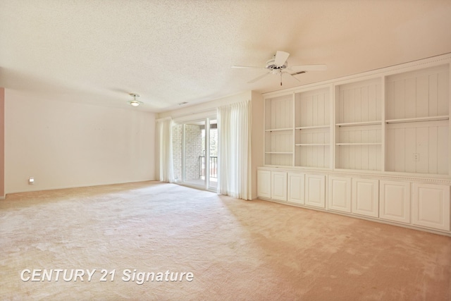 4515 Gratiot Rd, Saginaw, MI 48638 - carpeted spare room featuring a ceiling fan and a textured ceiling