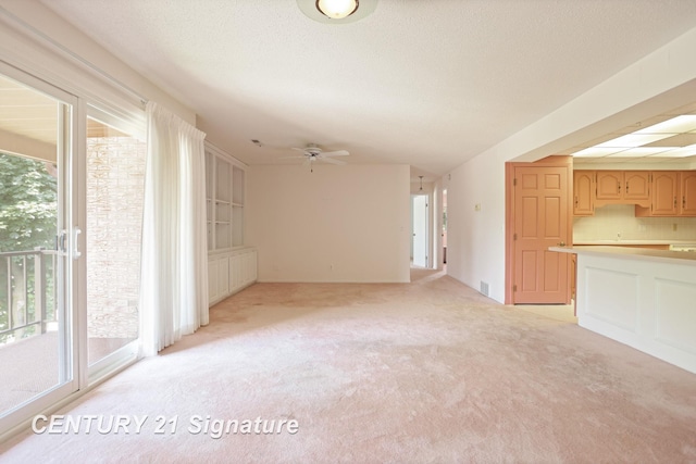 4515 Gratiot Rd, Saginaw, MI 48638 - unfurnished living room with light colored carpet and ceiling fan