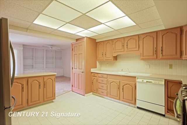 4515 Gratiot Rd, Saginaw, MI 48638 - kitchen with white dishwasher, freestanding refrigerator, light countertops, stove, and a paneled ceiling