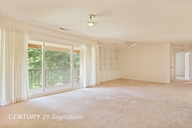 4515 Gratiot Rd, Saginaw, MI 48638 - carpeted spare room featuring ceiling fan and a textured ceiling