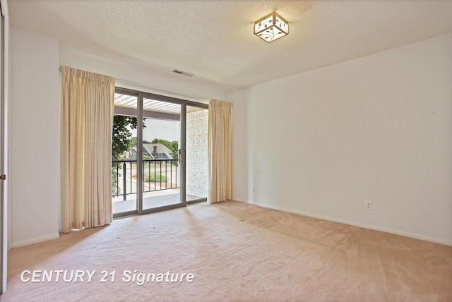 4515 Gratiot Rd, Saginaw, MI 48638 - carpeted empty room featuring a textured ceiling and baseboards