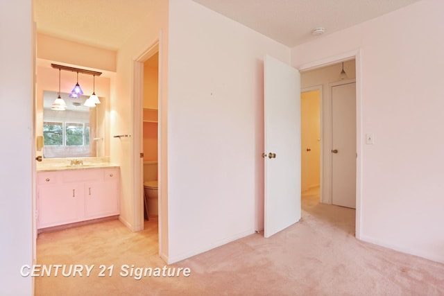 4515 Gratiot Rd, Saginaw, MI 48638 - corridor with light carpet and a sink