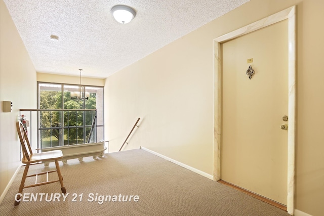 4515 Gratiot Rd, Saginaw, MI 48638 - unfurnished room featuring an upstairs landing, carpet floors, a textured ceiling, and a chandelier