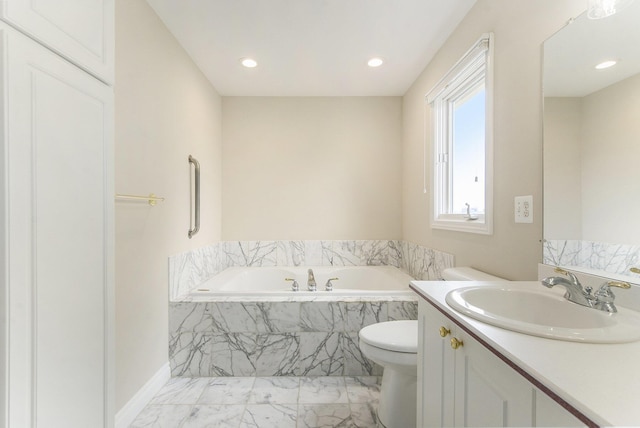 436 Pine Brae St, Ann Arbor, MI 48105 - bathroom featuring marble finish floors, vanity, a garden tub, and recessed lighting