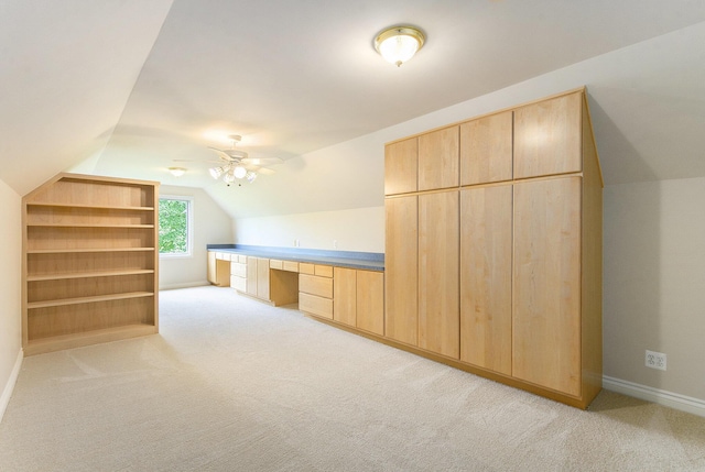 436 Pine Brae St, Ann Arbor, MI 48105 - additional living space with lofted ceiling, built in desk, light carpet, and ceiling fan