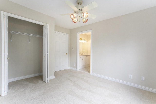 436 Pine Brae St, Ann Arbor, MI 48105 - unfurnished bedroom featuring light carpet, a closet, connected bathroom, and a ceiling fan