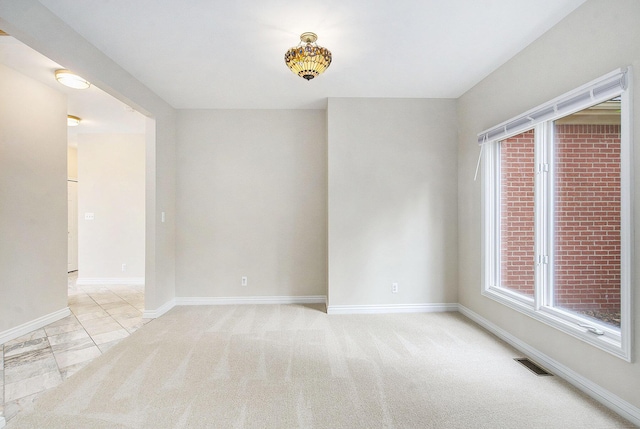 436 Pine Brae St, Ann Arbor, MI 48105 - spare room with baseboards and light colored carpet