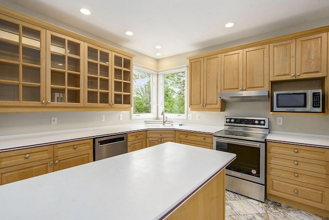 436 Pine Brae St, Ann Arbor, MI 48105 - kitchen with stainless steel appliances, under cabinet range hood, glass insert cabinets, light marble finish floors, and light countertops