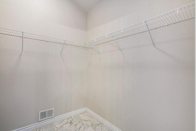 436 Pine Brae St, Ann Arbor, MI 48105 - walk in closet featuring light marble finish flooring