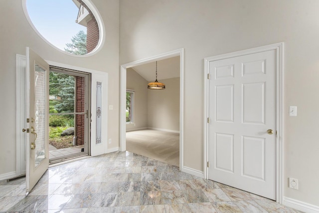 436 Pine Brae St, Ann Arbor, MI 48105 - foyer with marble tiled flooring and a towering ceiling