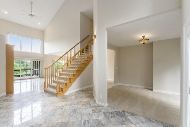 436 Pine Brae St, Ann Arbor, MI 48105 - stairway with ceiling fan and high vaulted ceiling