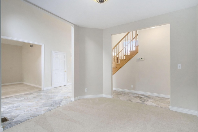 436 Pine Brae St, Ann Arbor, MI 48105 - carpeted spare room with stairs and a high ceiling