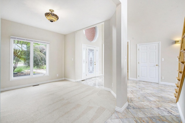 436 Pine Brae St, Ann Arbor, MI 48105 - entrance foyer with stairs, a high ceiling, and light colored carpet