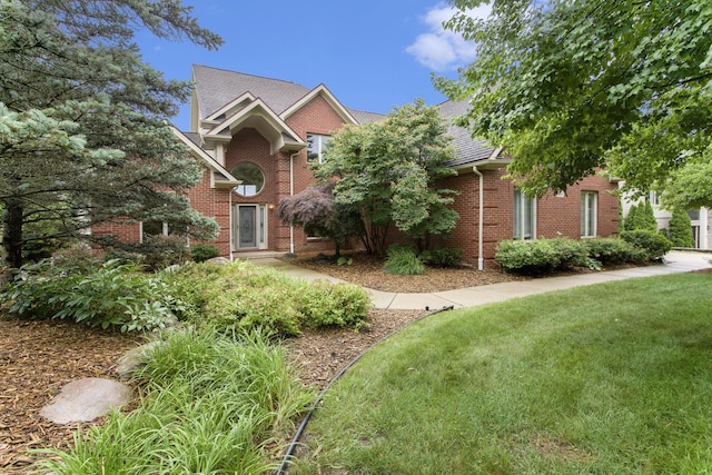 436 Pine Brae St, Ann Arbor, MI 48105 - view of front facade with brick siding and a front lawn