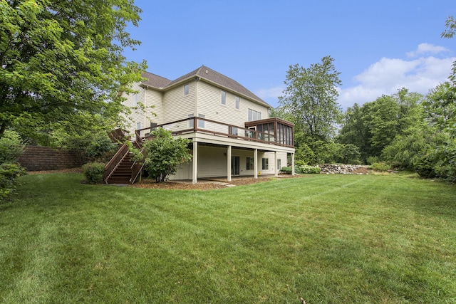 436 Pine Brae St, Ann Arbor, MI 48105 - rear view of property with stairway, a deck, and a lawn