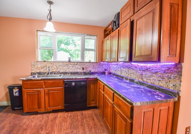500 W Chicago St, Coldwater, MI 49036 - kitchen featuring black dishwasher, dark countertops, decorative backsplash, and dark wood-style floors