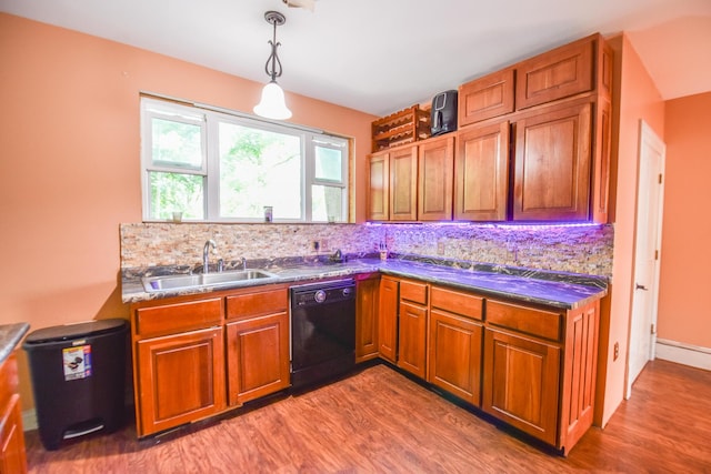 500 W Chicago St, Coldwater, MI 49036 - kitchen featuring black dishwasher, wood finished floors, brown cabinets, and tasteful backsplash