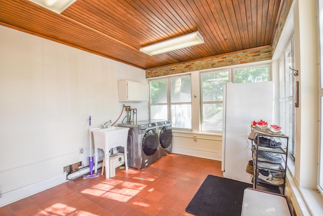 500 W Chicago St, Coldwater, MI 49036 - laundry room featuring cabinet space, washing machine and dryer, wood ceiling, and brick patterned floors