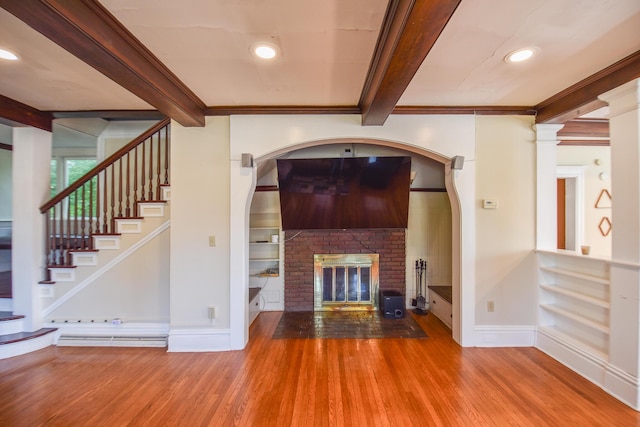 500 W Chicago St, Coldwater, MI 49036 - unfurnished living room featuring beamed ceiling, crown molding, wood finished floors, stairway, and recessed lighting