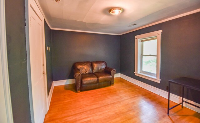 500 W Chicago St, Coldwater, MI 49036 - living area featuring light wood-style flooring and ornamental molding